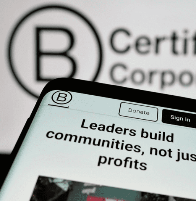 B Corp Logo. And a phone saying: Leaders build communities not profit