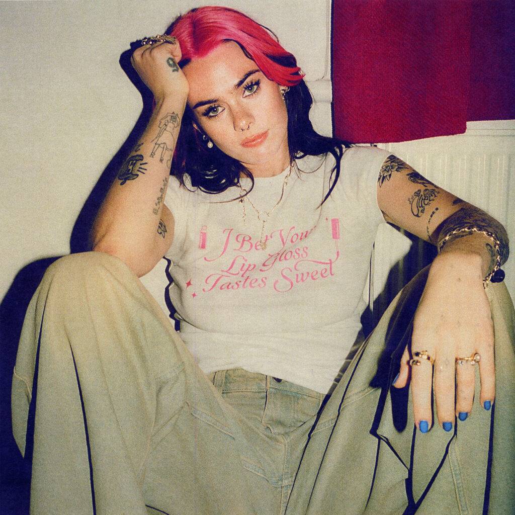 Girli sitting down beside a radiator.