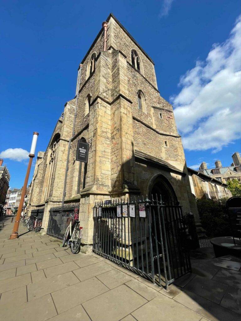 Stone tower building with the sun shining on it